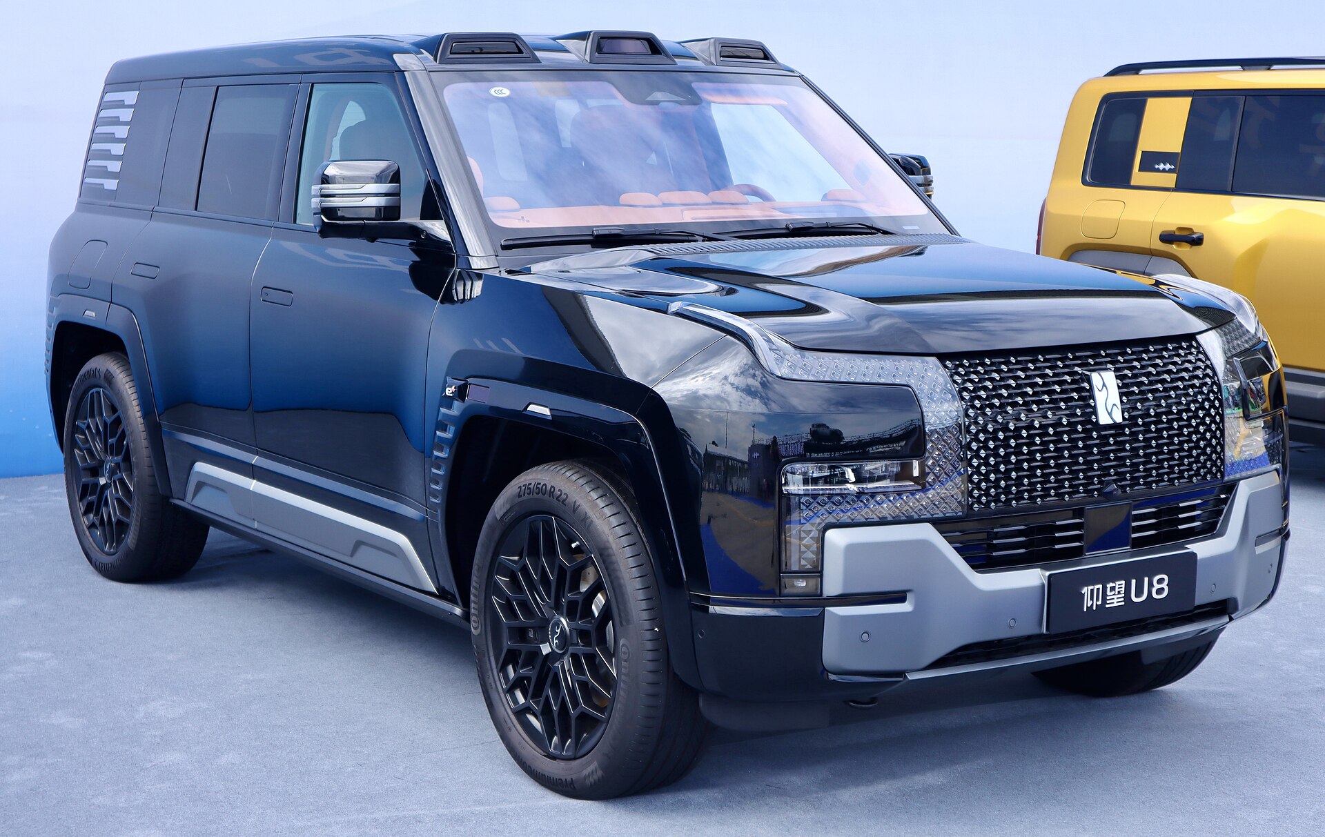 Green YANGWANG U8 luxury SUV with a distinctive upright profile